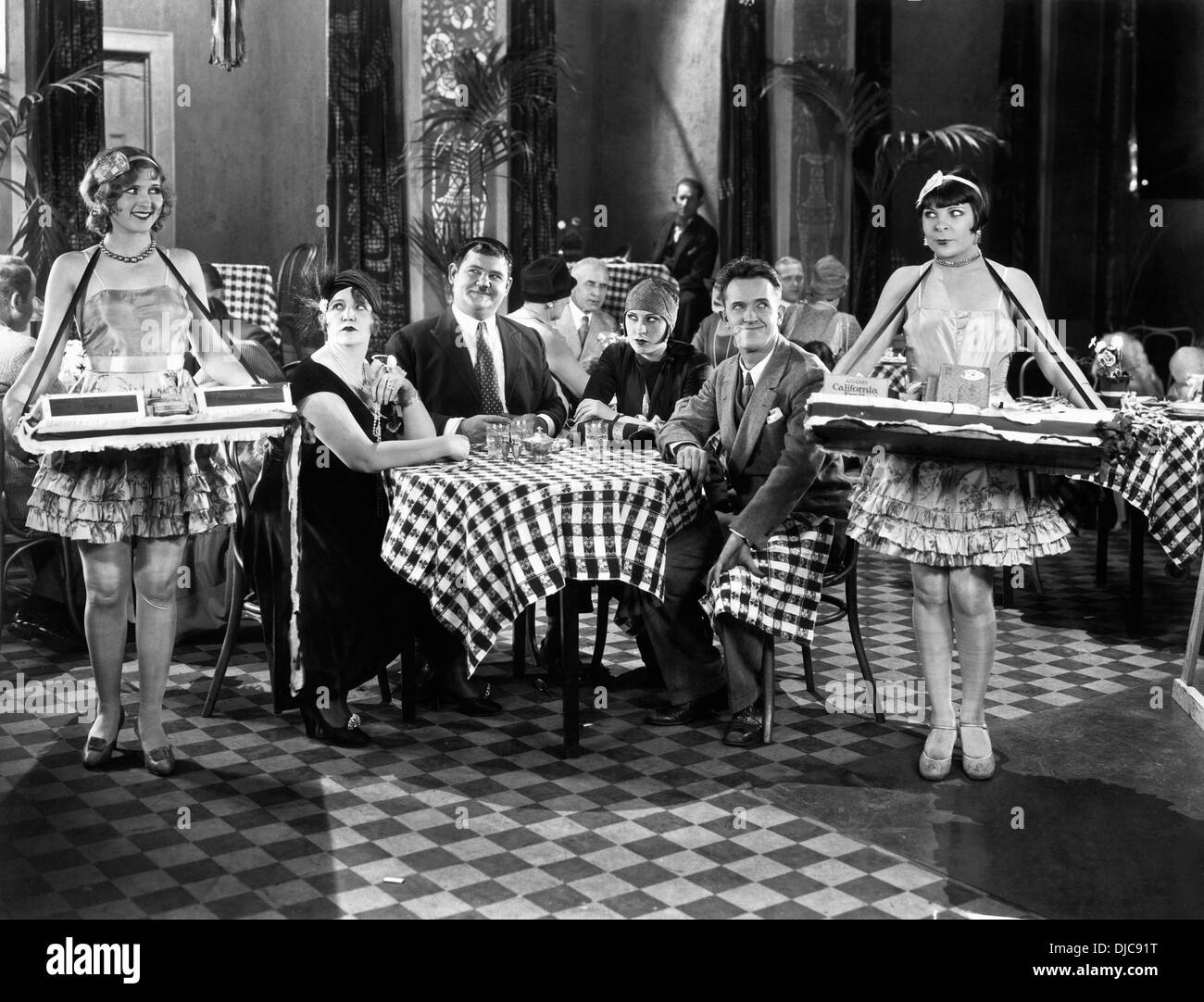 Anita Garvin, Oliver Hardy, Kay Deslys and Stan Laurel on-set of the Film, Their Purple Moment, 1928 Stock Photo