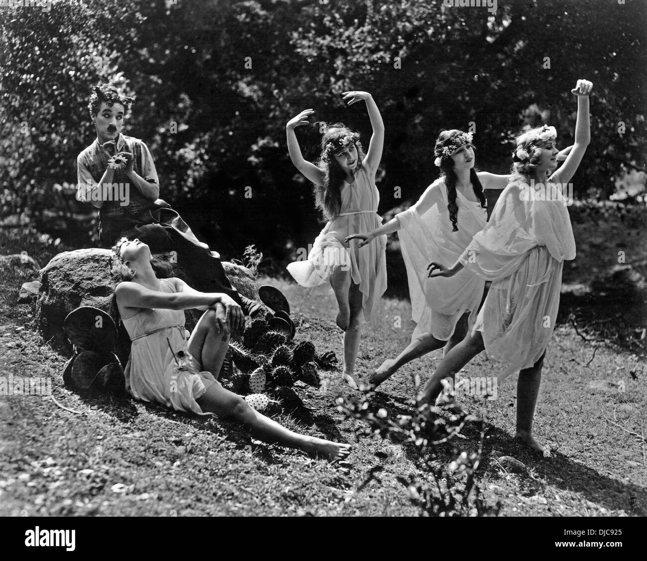 Charlie Chaplin and Group of Women on-set of the Film, Sunnyside, 1919 Stock Photo