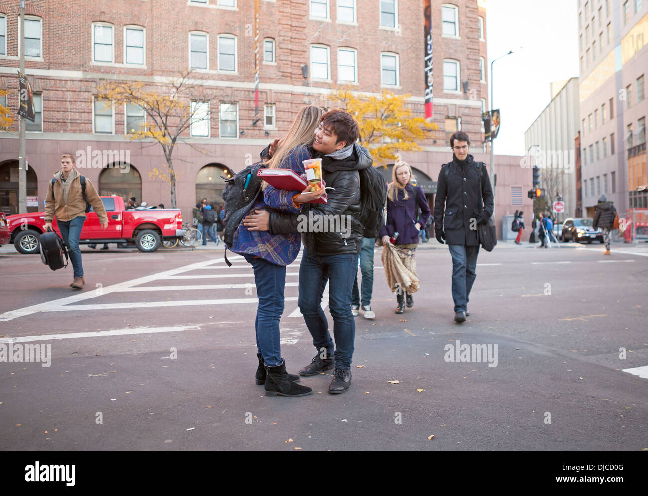 Two friends hug each other outside in Boston, Massachusetts, USA Stock Photo Alamy