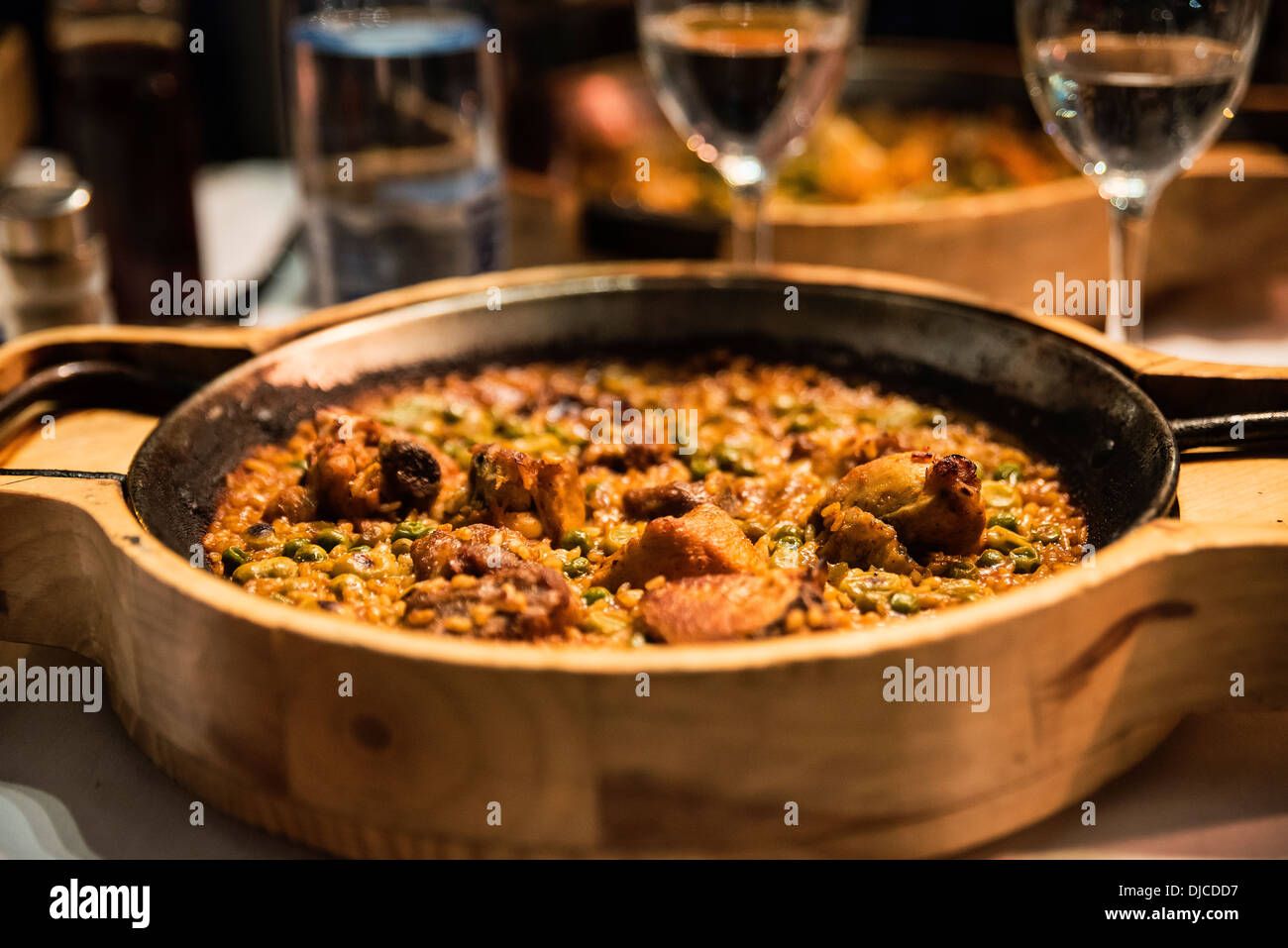 Paella with chicken served in a restaurant, Barcelona, Spain Stock Photo