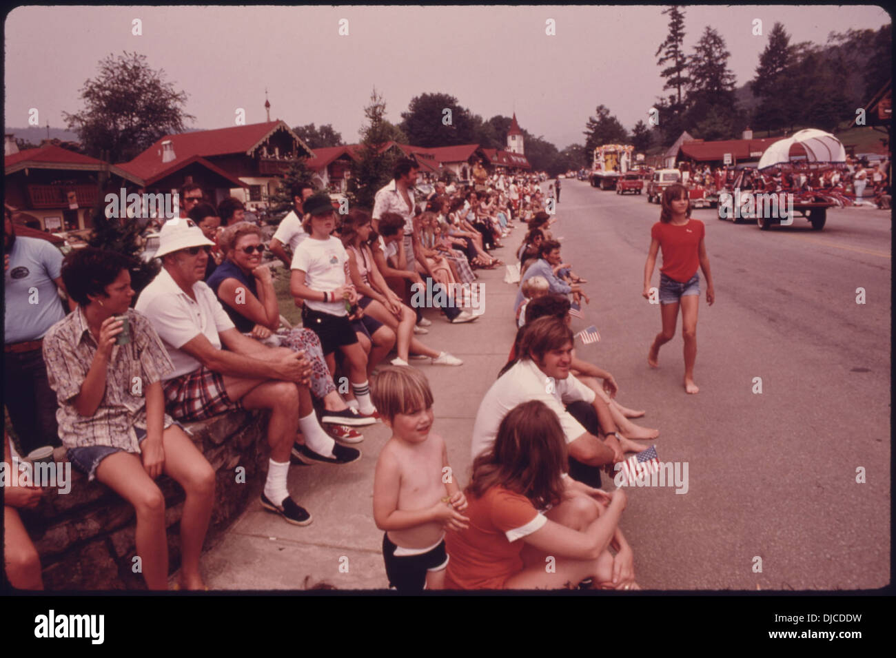 TOURISTS AND TOWNSPEOPLE LINE THE MAIN STREET OF HELEN NEAR