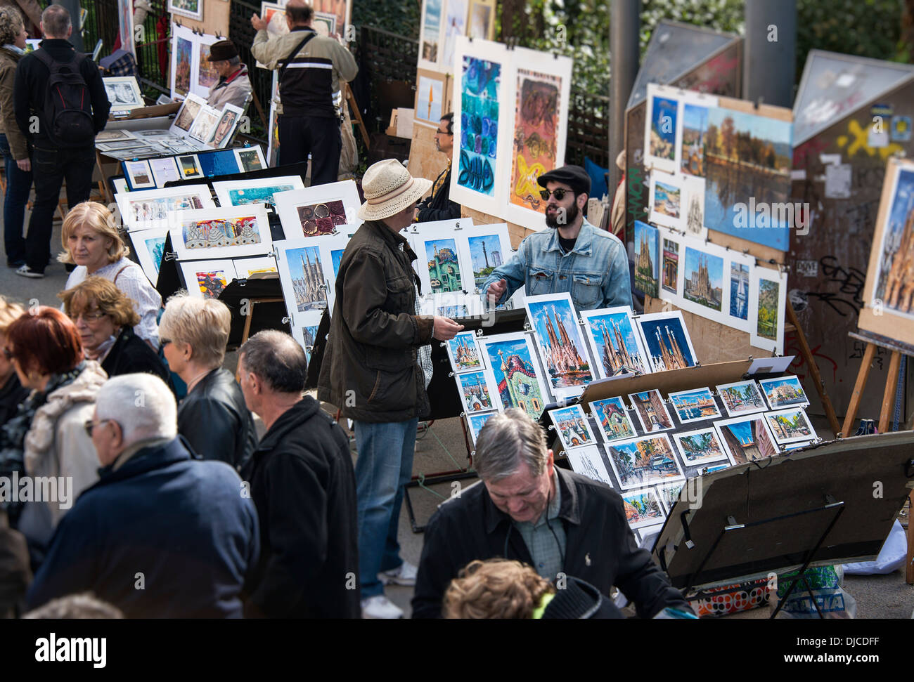 Art street vendors sell their wares outside the Basilica Sagrada Família, Barcelona, Spain Stock Photo