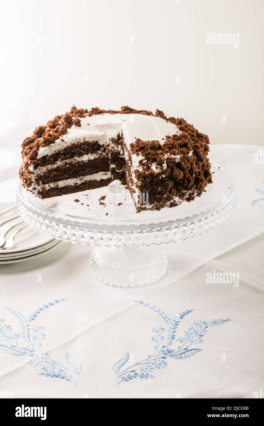Chocolate crumb layer cake with white icing Stock Photo Alamy