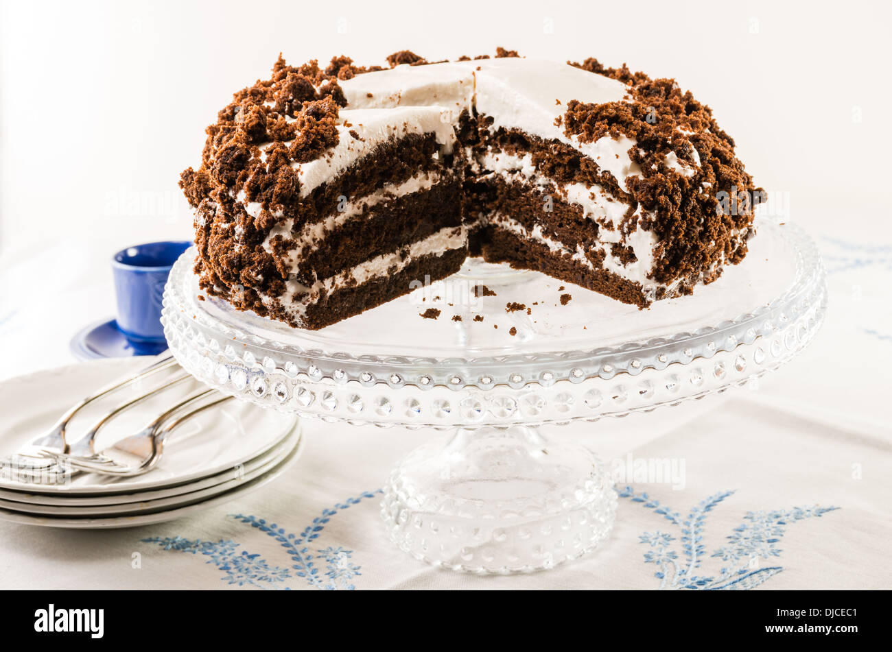 Chocolate crumb layer cake with white icing Stock Photo Alamy