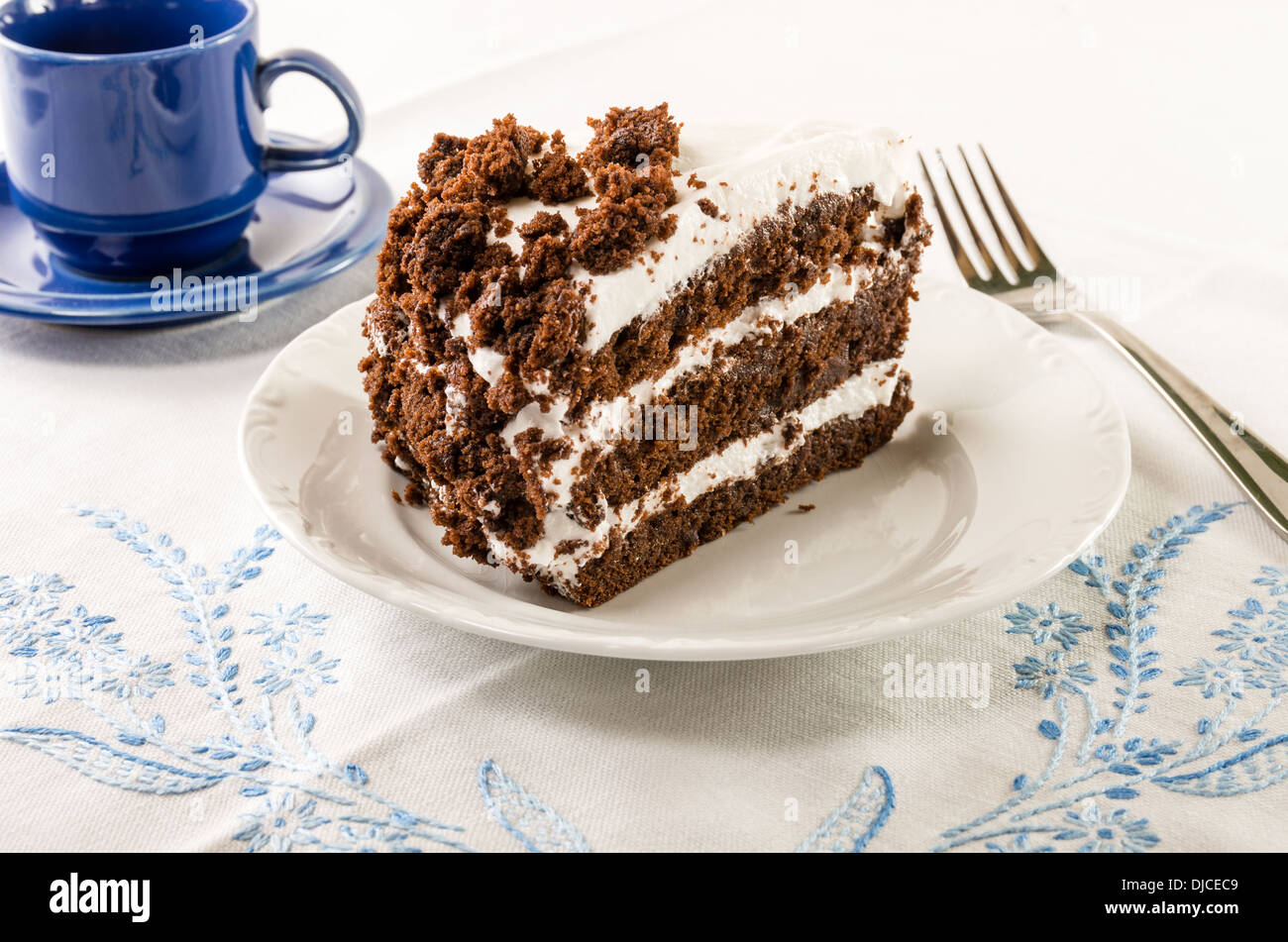 Chocolate crumb layer cake with white icing Stock Photo