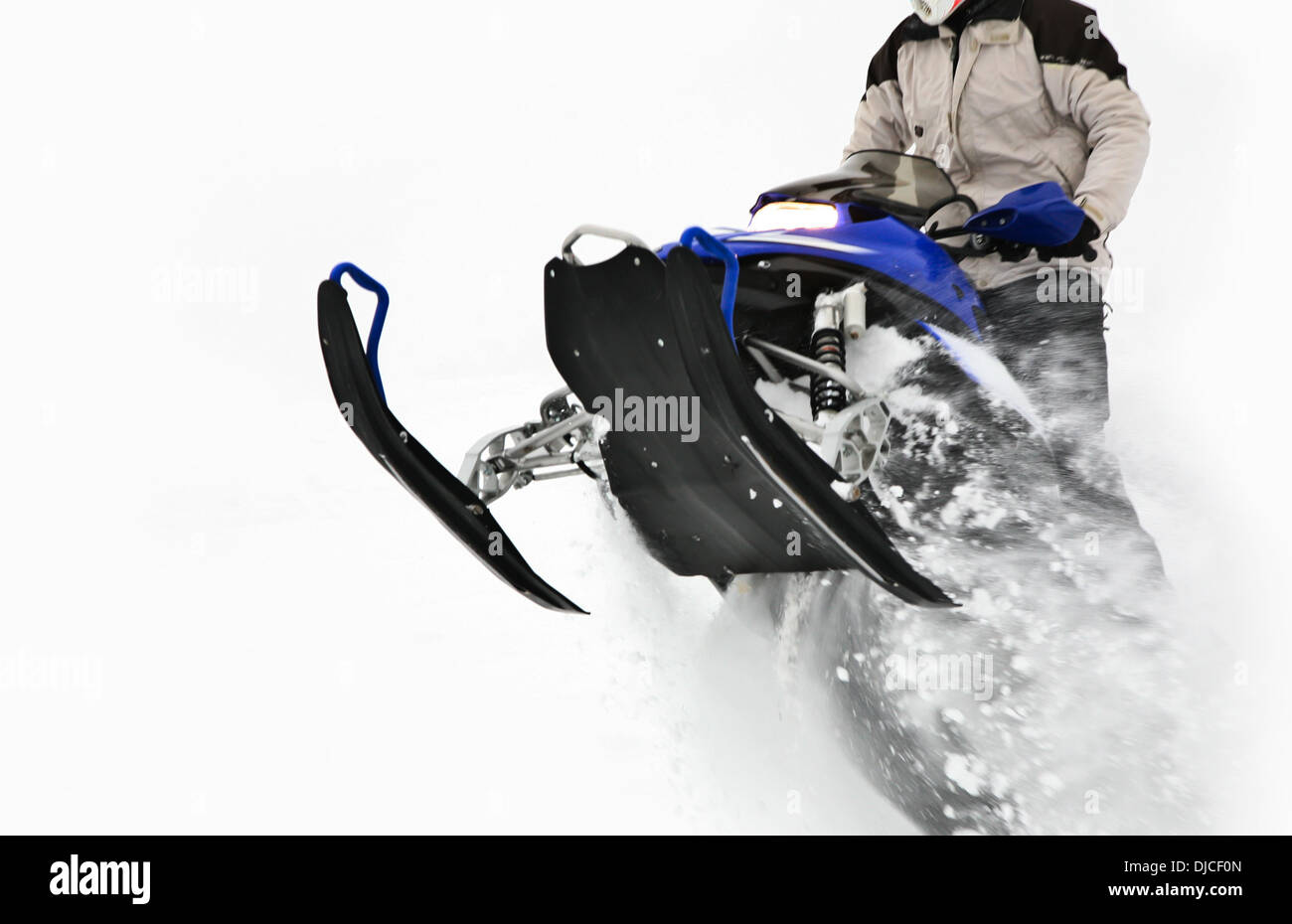 Snowmobile Jump. Extreme Snowmobile Ride. Winter Recreation Stock Photo