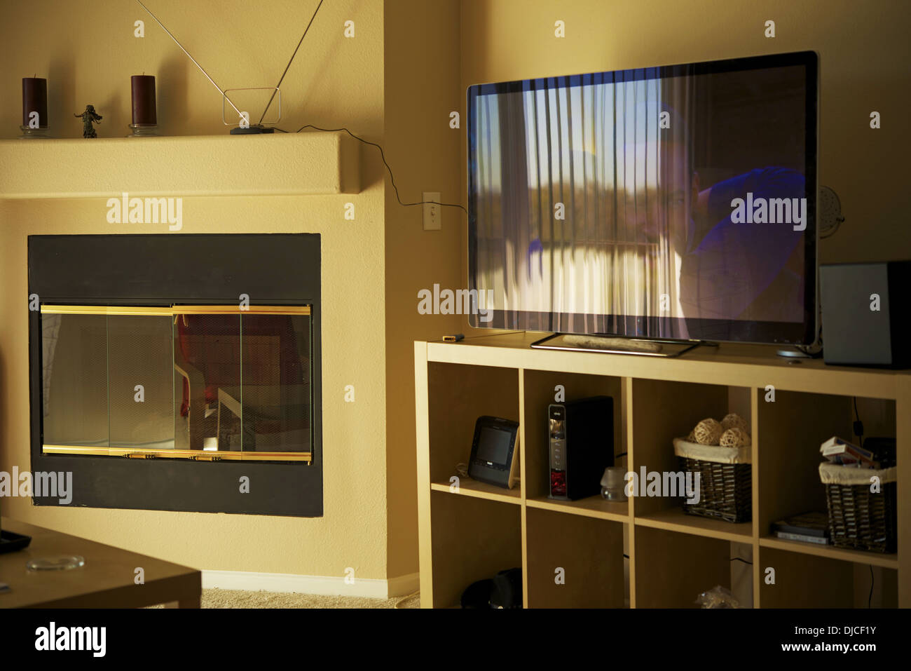 American Style Dining Room with Fireplace and Large Flat TV. Home Interiors Photo Collection. Stock Photo