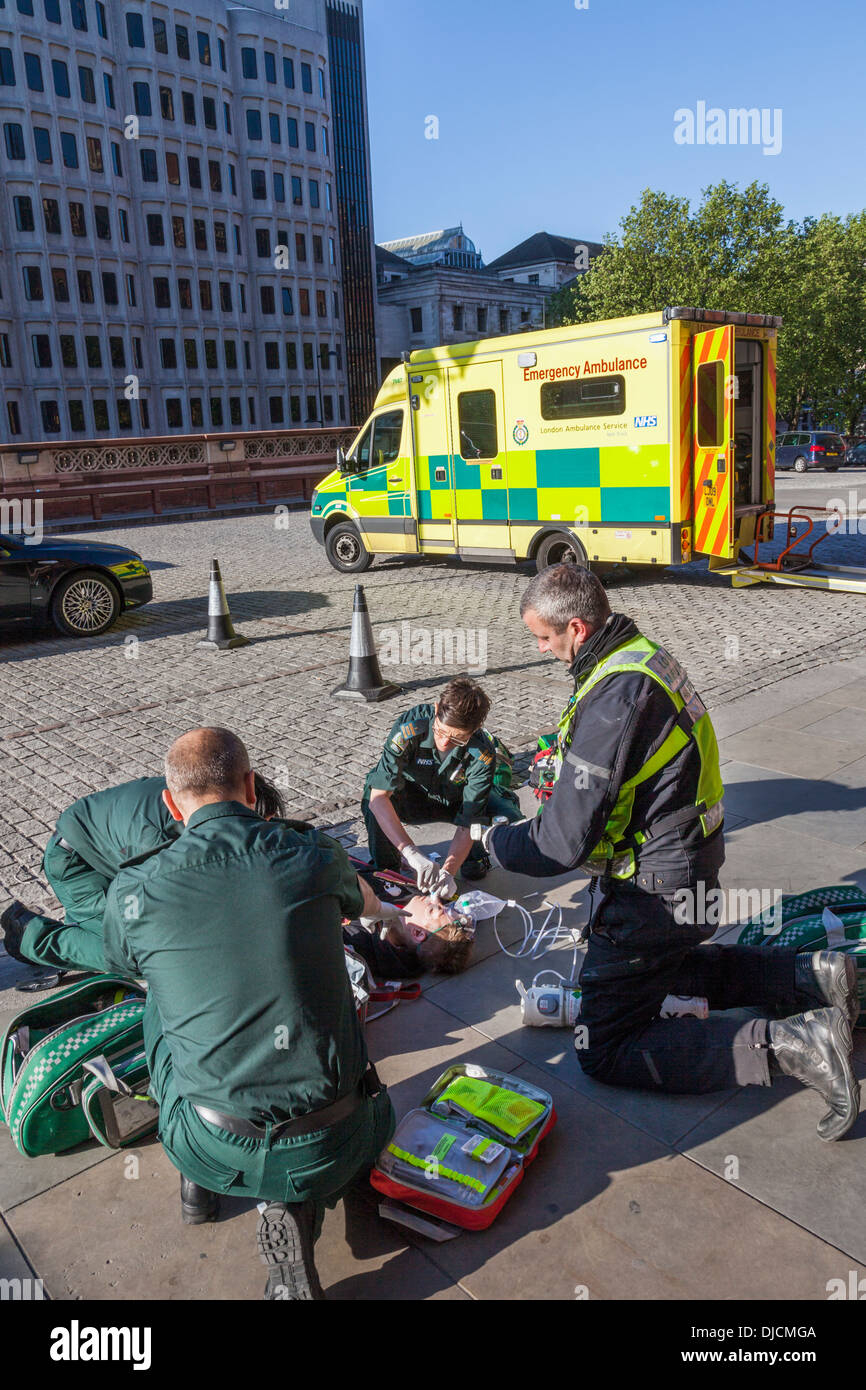 England, London, Medics Attending Sick Person Stock Photo