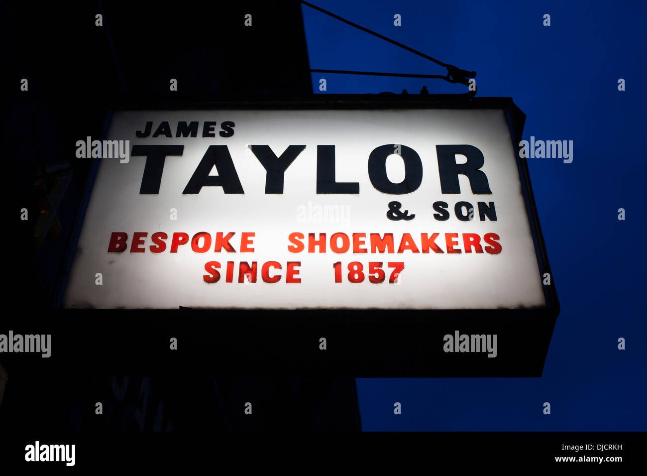 James Taylor & Son Bespoke Shoemakers Since 1857 sign outside shoe / shoemaker shop at dusk / night Marylebone London England UK Stock Photo