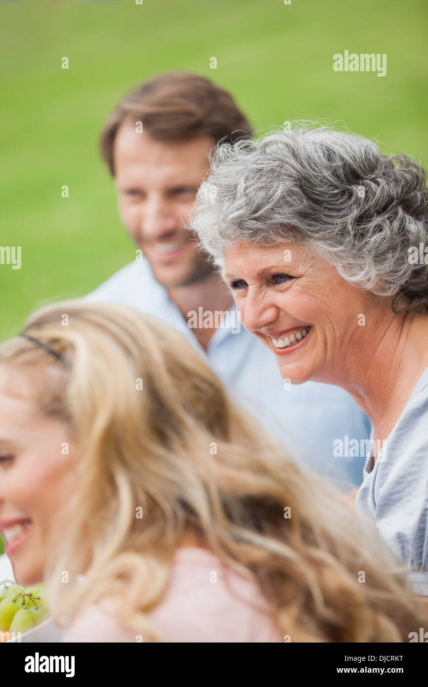 Smiling retired woman with her family Stock Photo