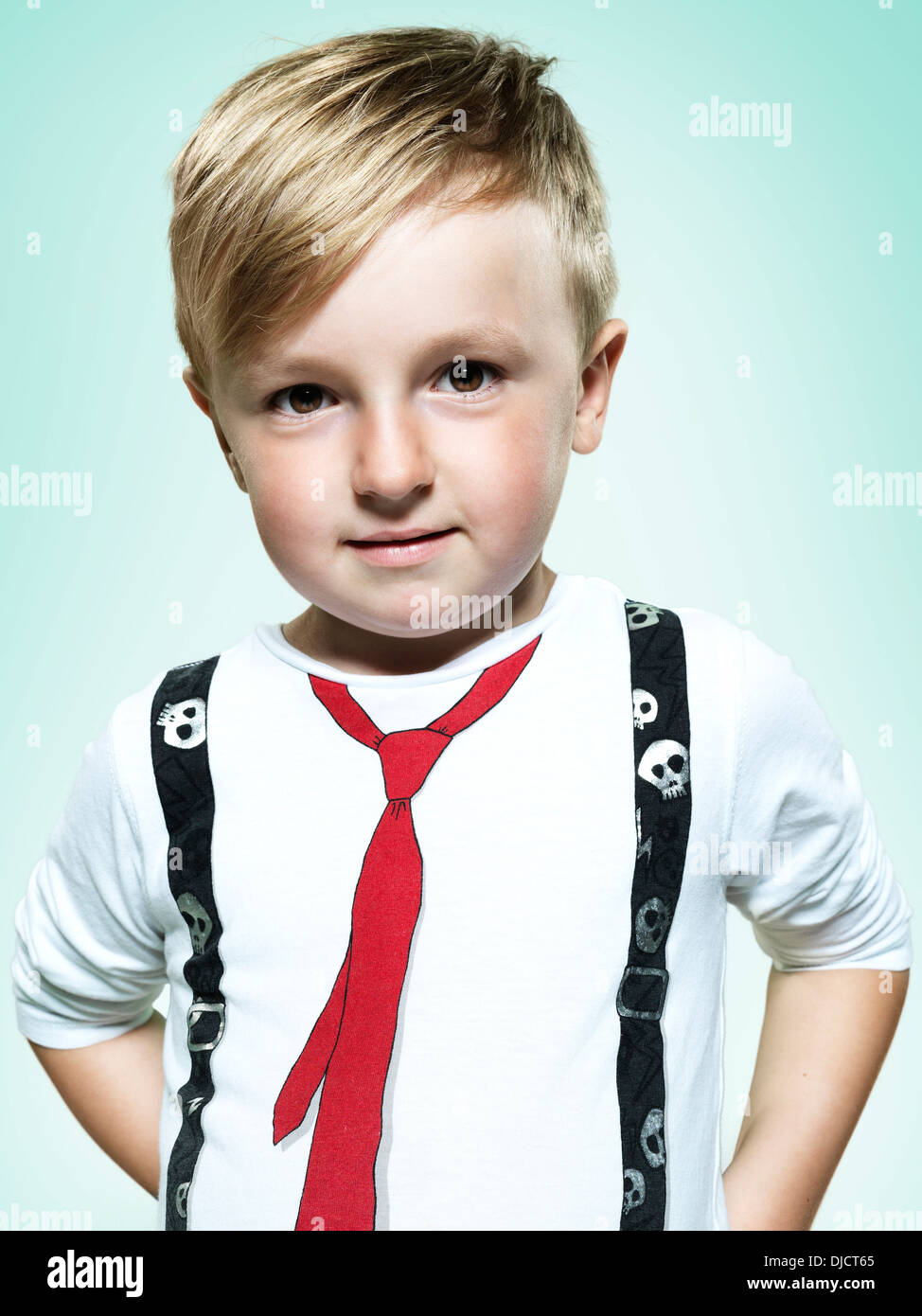 Little boy with hands behind back hires stock photography and images