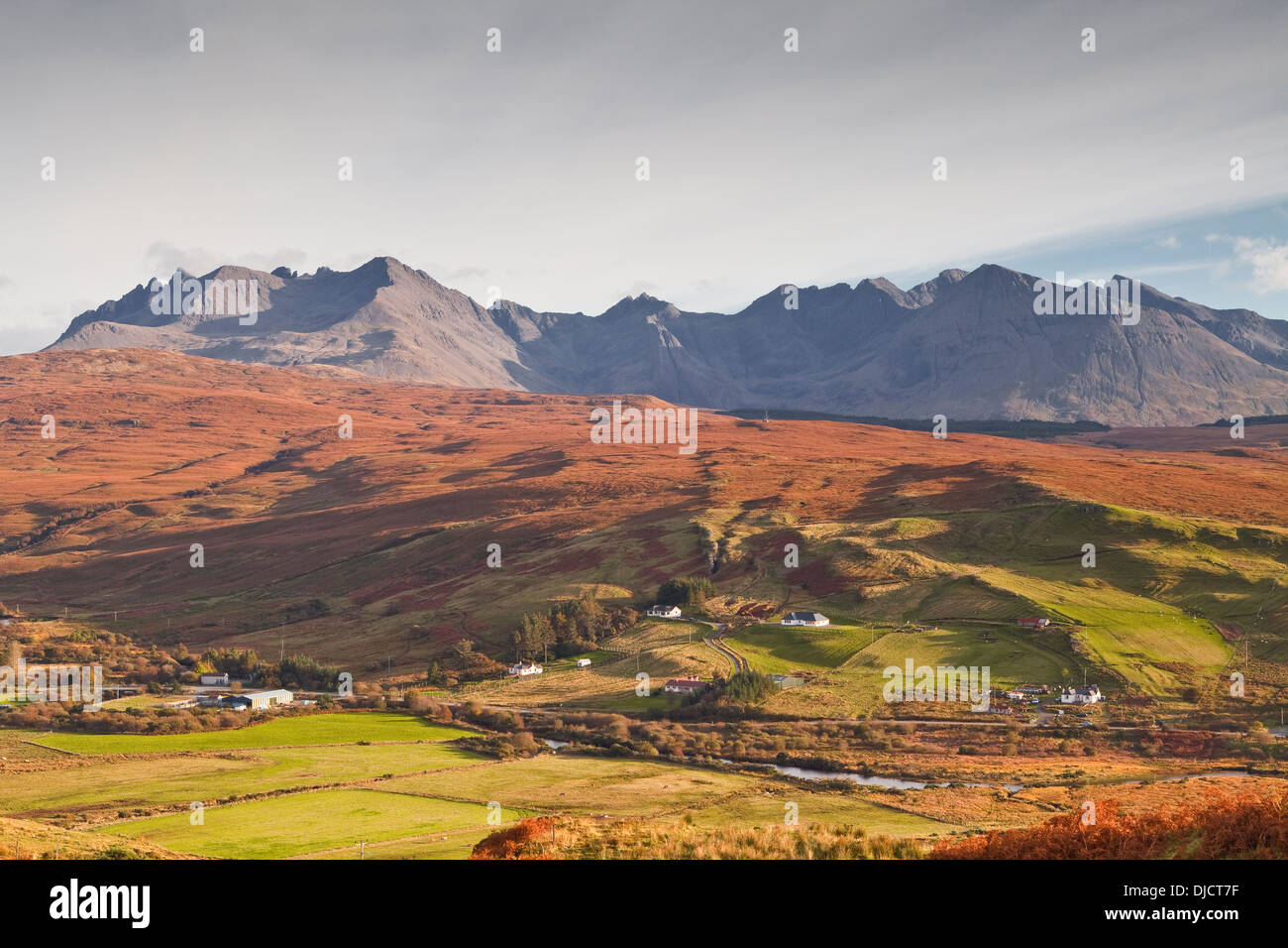 The village of Carbost with Glen Brittle looming behind. Stock Photo