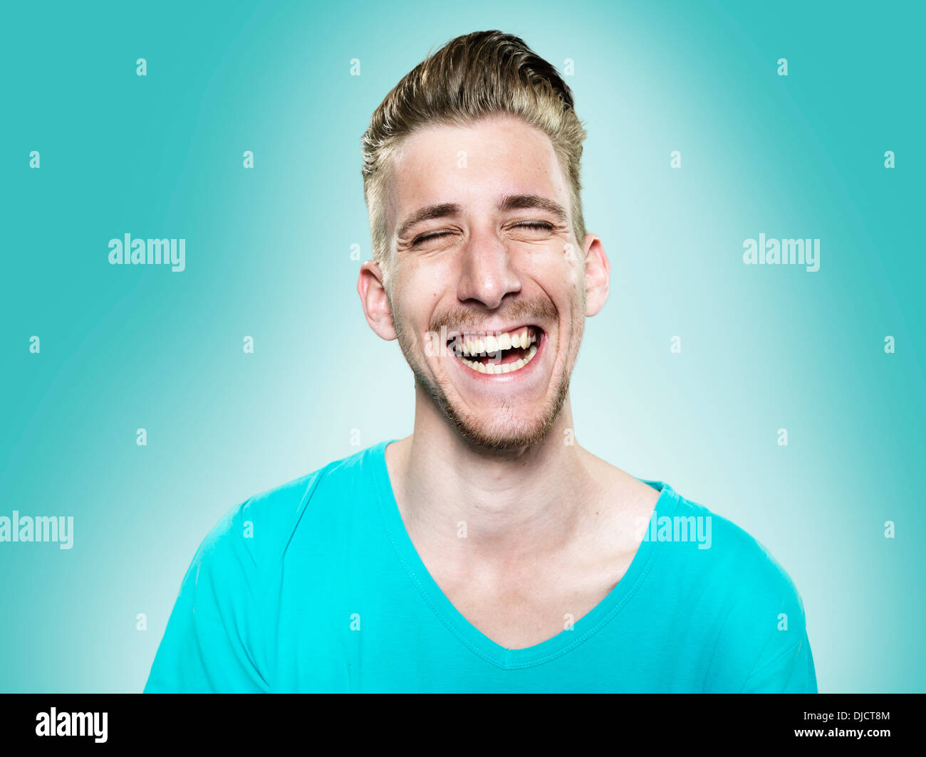 Portrait of laughing young man, studio shot Stock Photo - Alamy