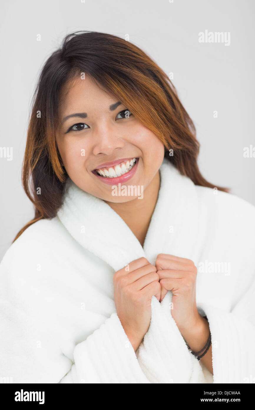 Pretty brunette woman wearing a bathrobe Stock Photo
