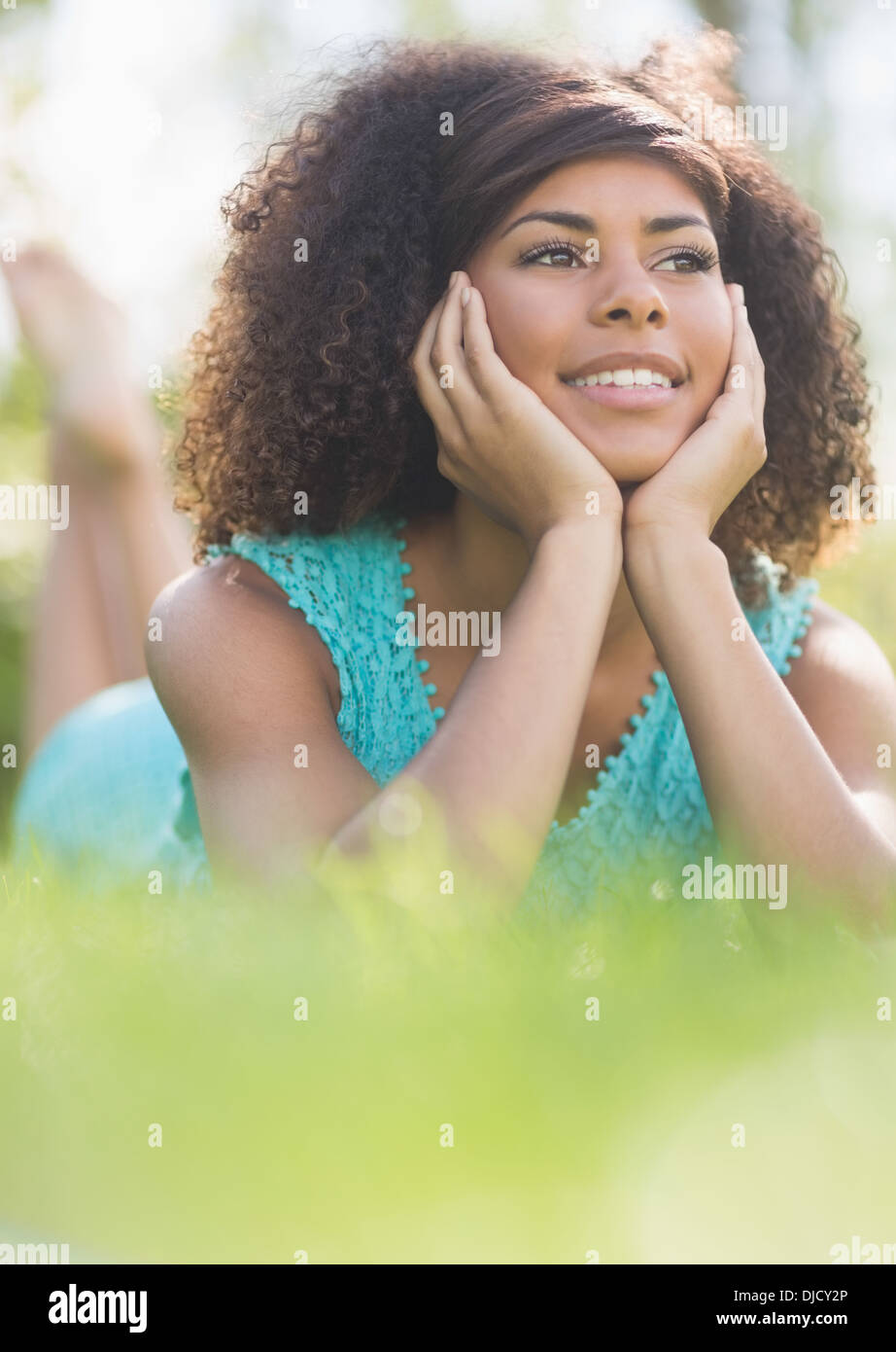 Gorgeous happy brunette day dreaming Stock Photo