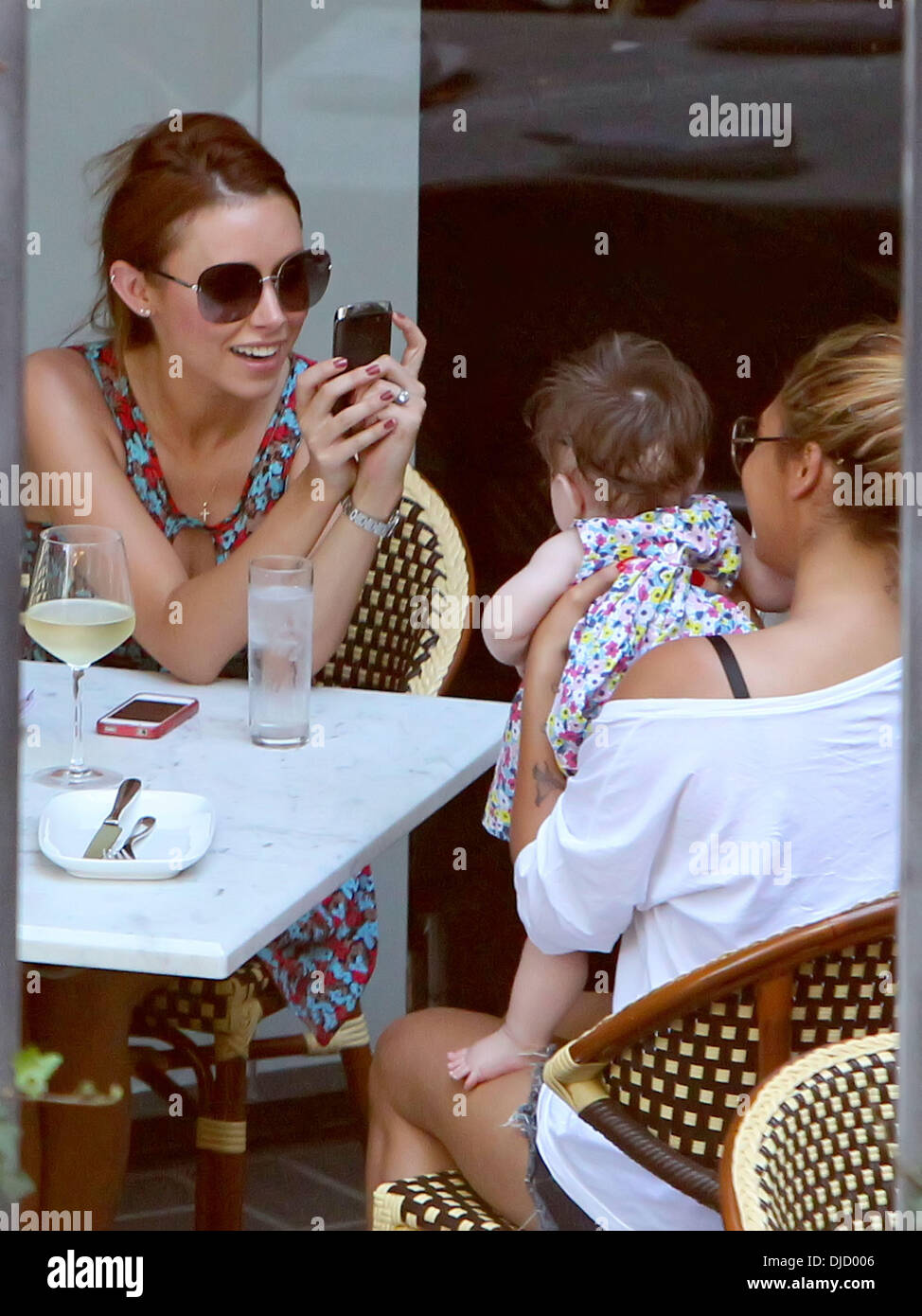 Una Healy Vanessa White And Aoife Belle Foden Una Healy Takes A Photo On Her Mobile Phone Of 