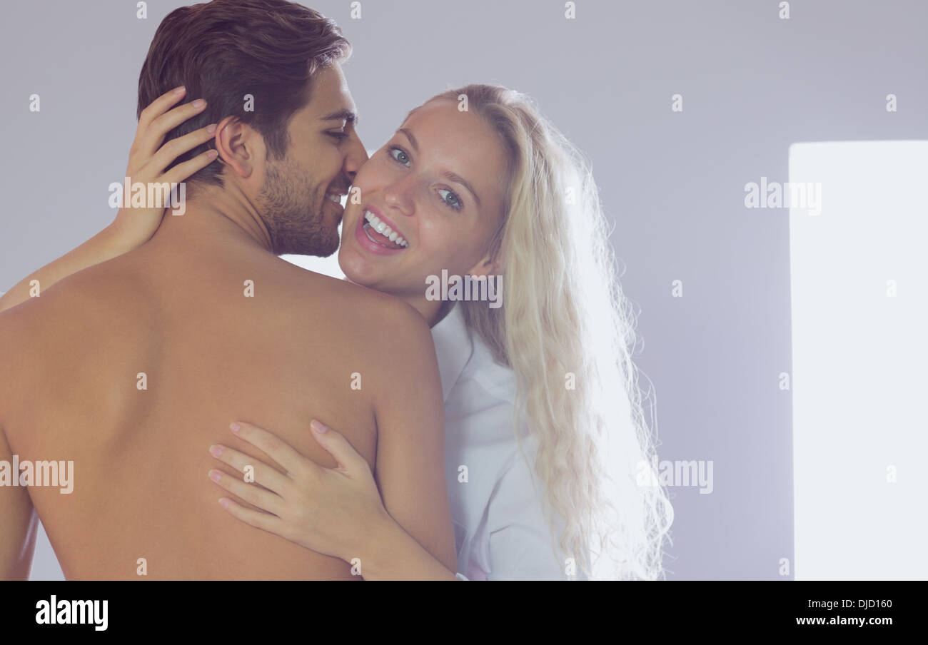 Cute woman embracing her boyfriend Stock Photo