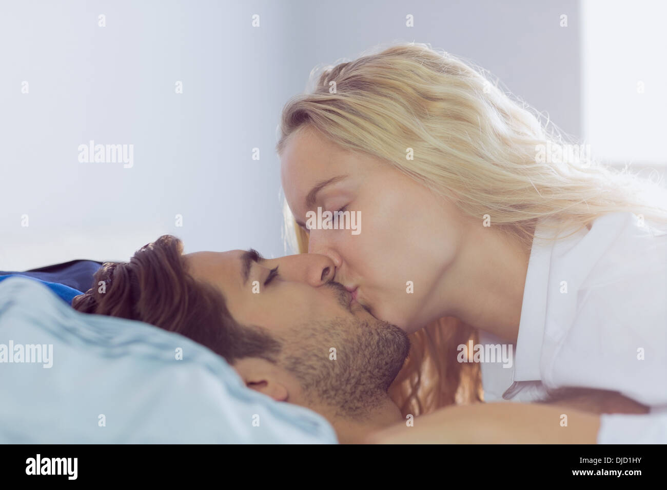 Intimate young couple kissing each other Stock Photo