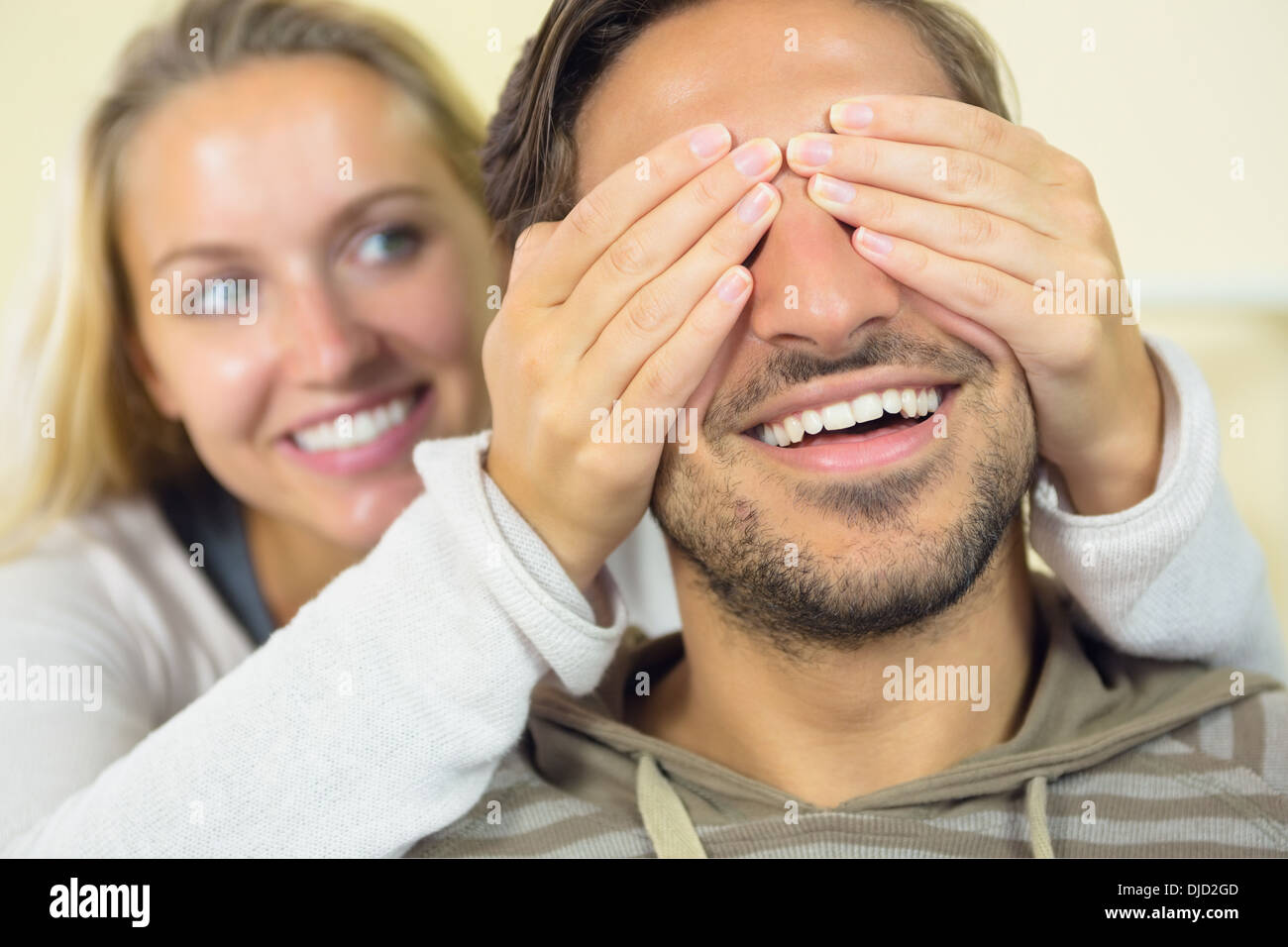 Amused young woman making fun with her boyfriend Stock Photo
