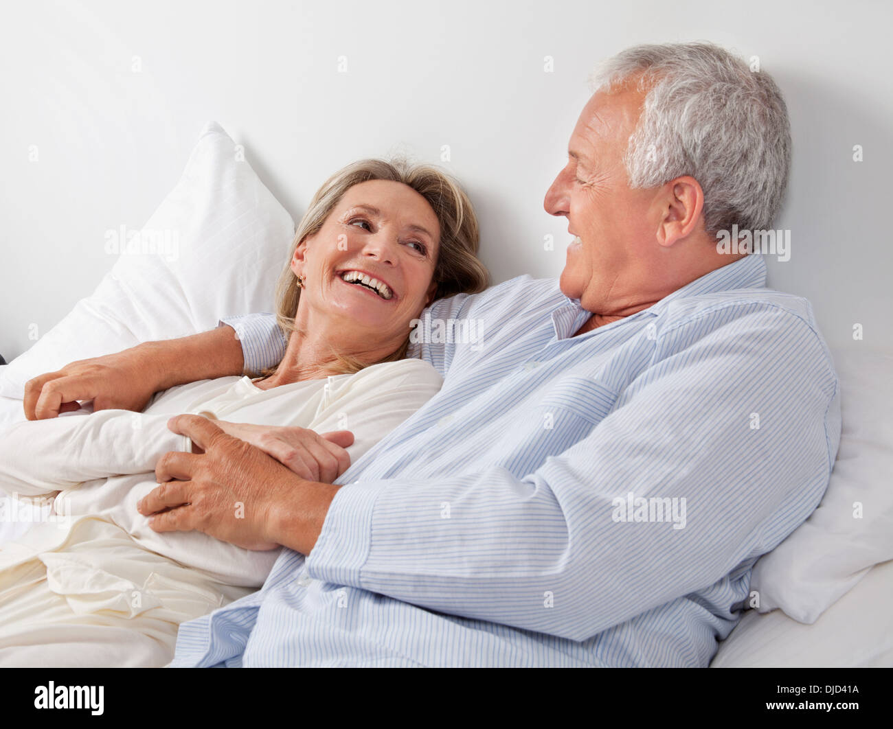 Attractive mature couple in bed hi-res stock photography and images - Alamy