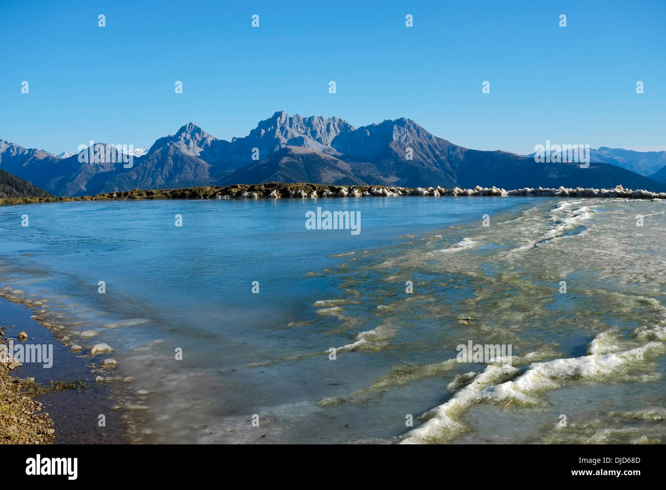 Frozen pond in the mountains hi-res stock photography and images - Alamy