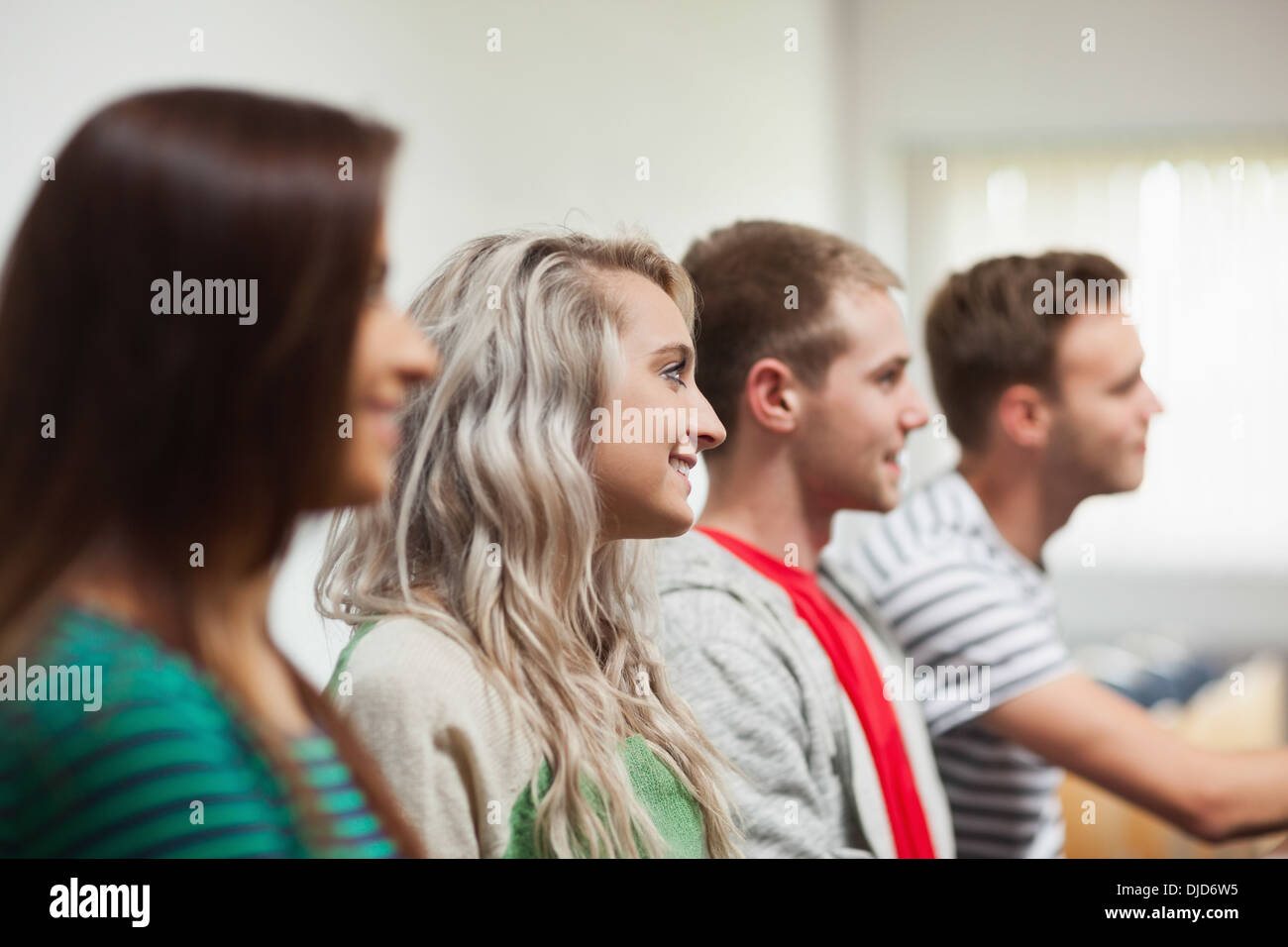 Casual happy students having lessons Stock Photo