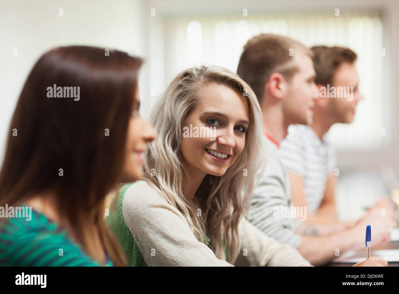 Blonde smiling student looking at camera Stock Photo