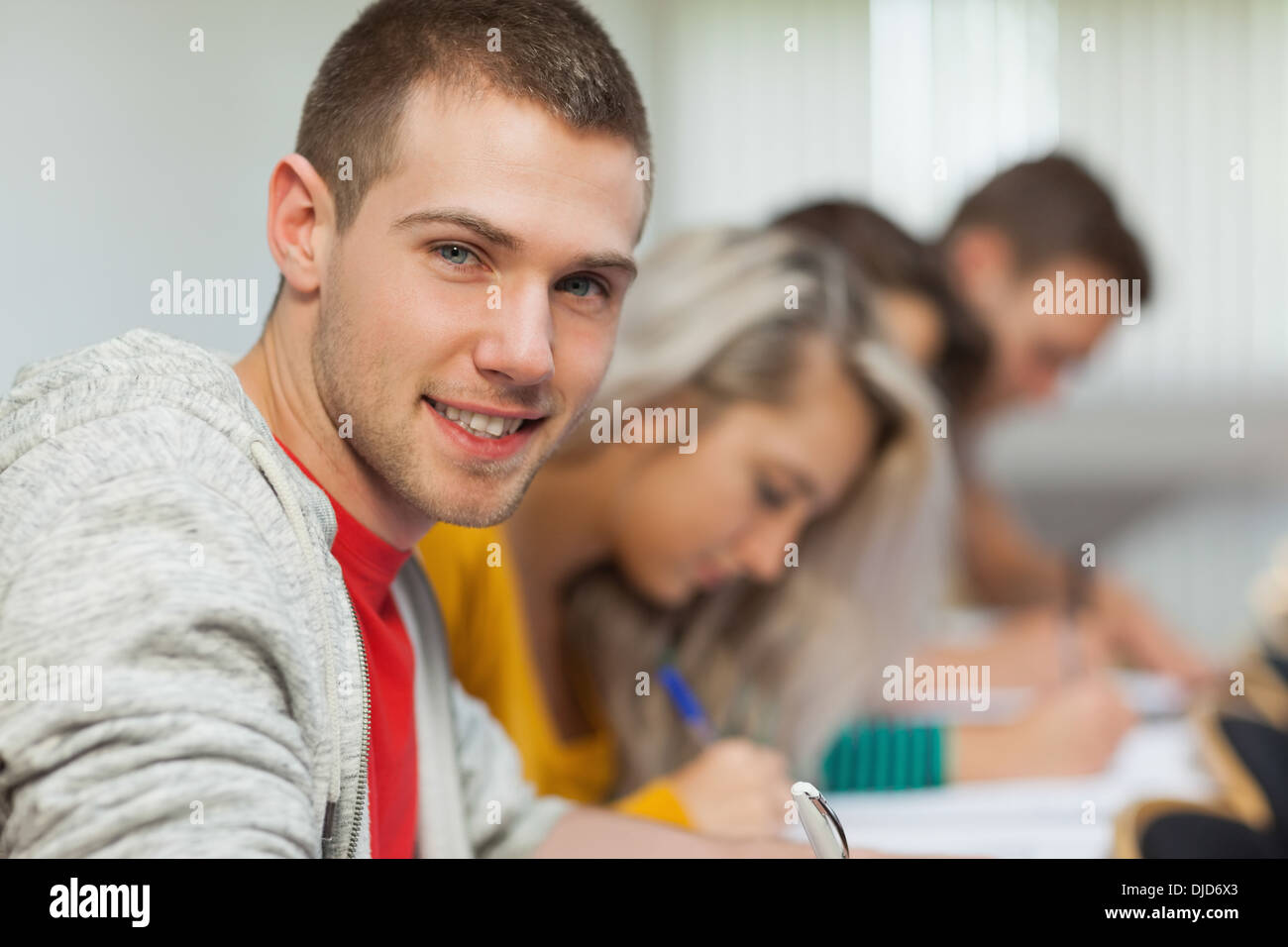 Smiling attractive student looking at camera Stock Photo