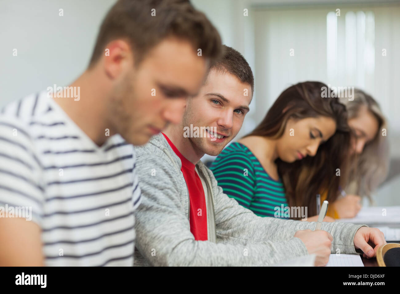 Happy attractive student looking at camera Stock Photo