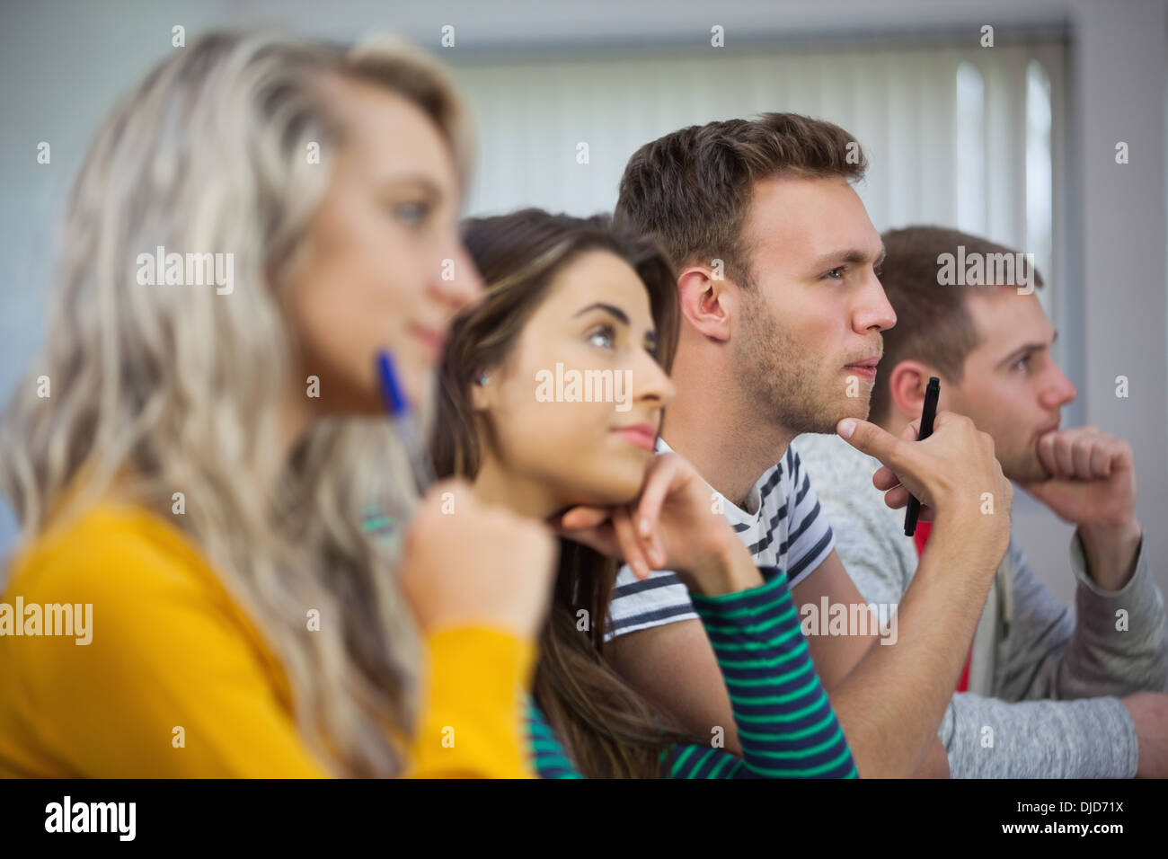 Group of casual students looking away Stock Photo