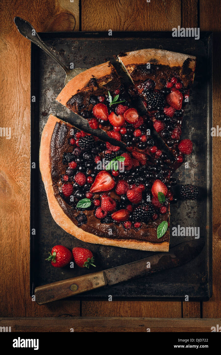 Pizza with berries with nutella and mint leaves Stock Photo Alamy