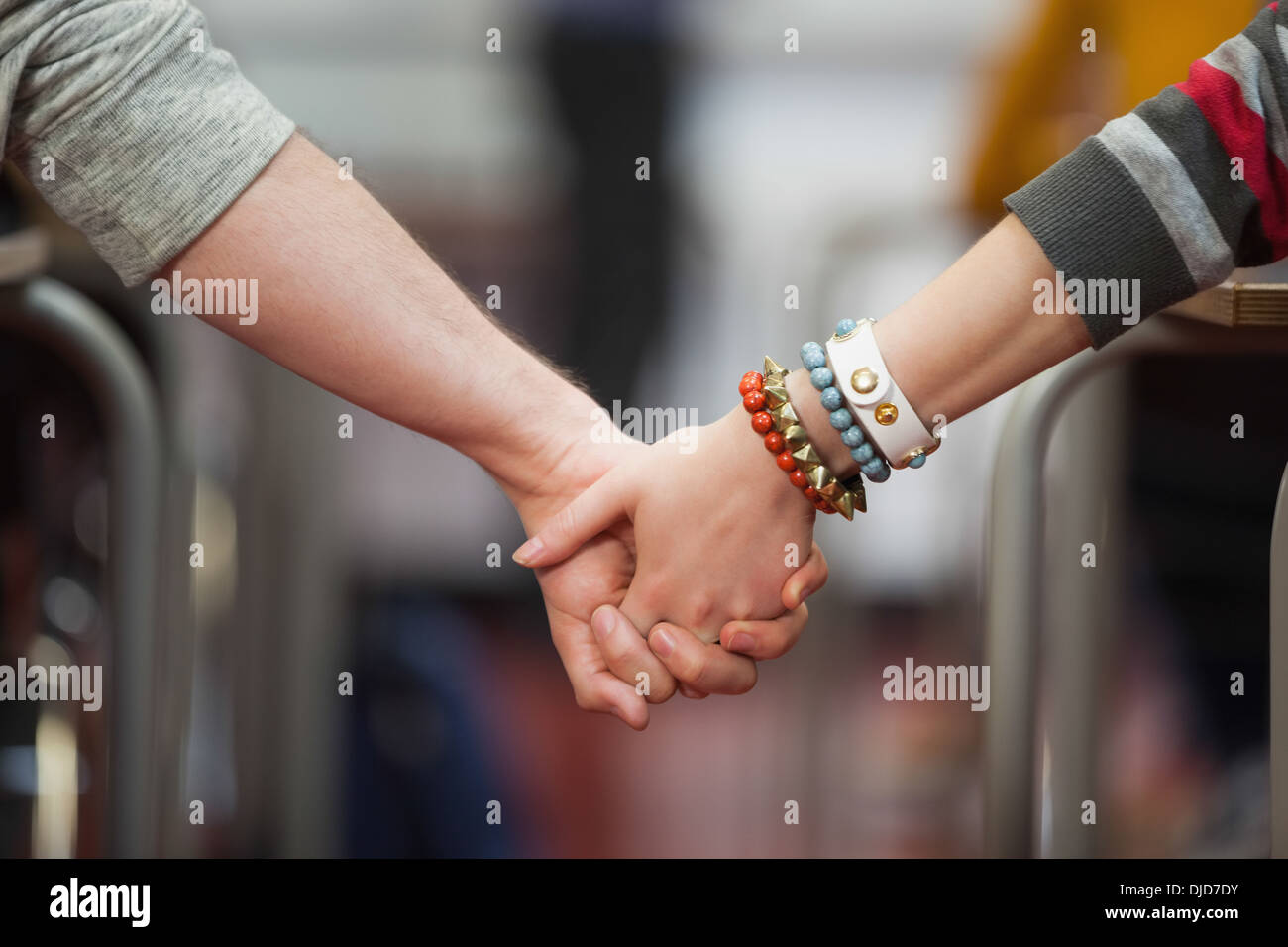 Students holding hands in class Stock Photo