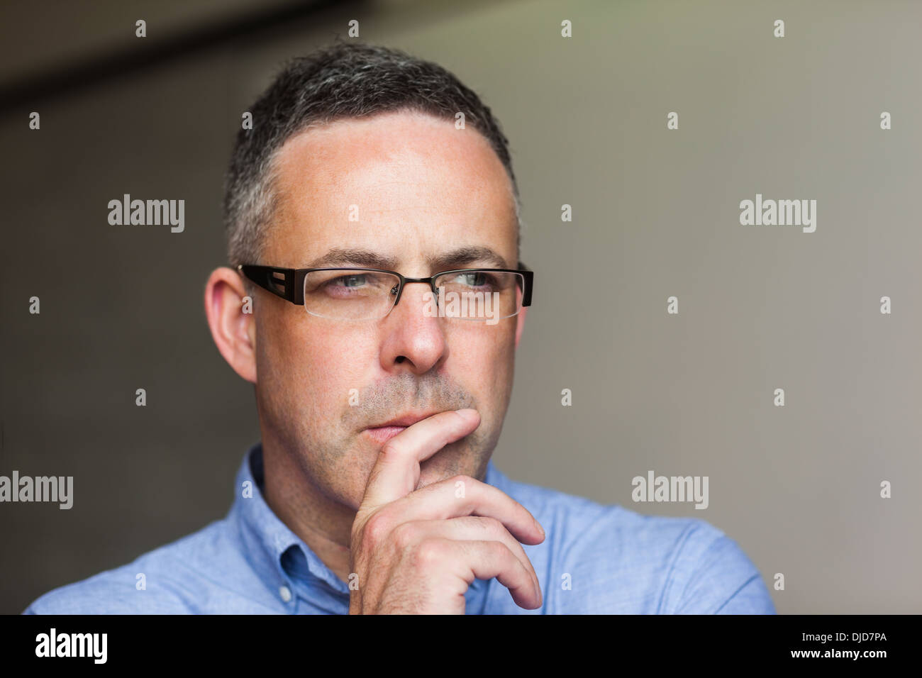 Concentrating Lecturer Looking Away In His Classroom Stock Photo Alamy