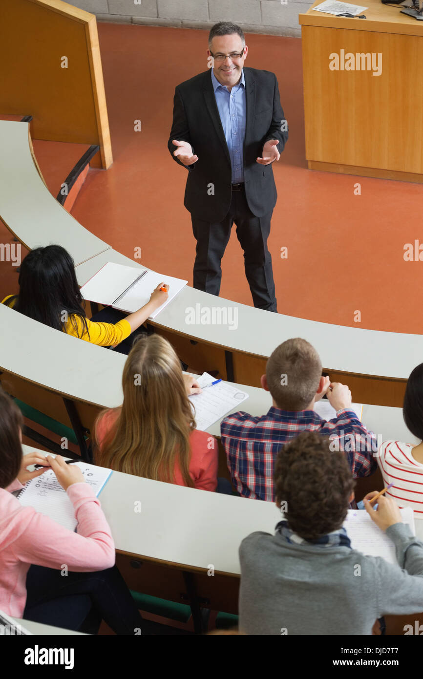 Happy lecturer speaking to his students Stock Photo