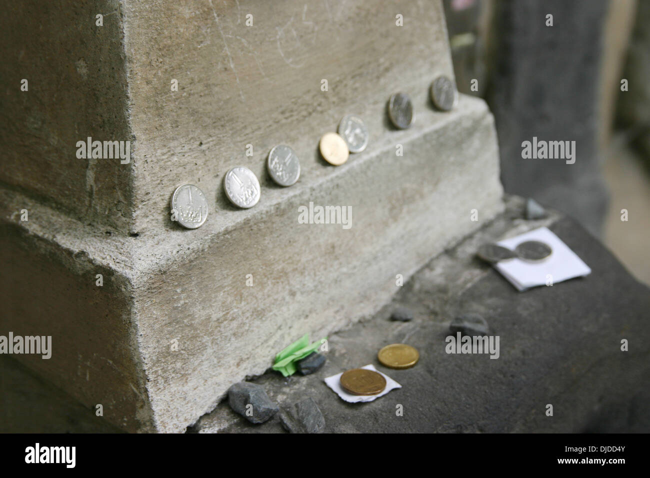 Coins on a gravestone at the Old Jewish Cemetery (Prague), Czech