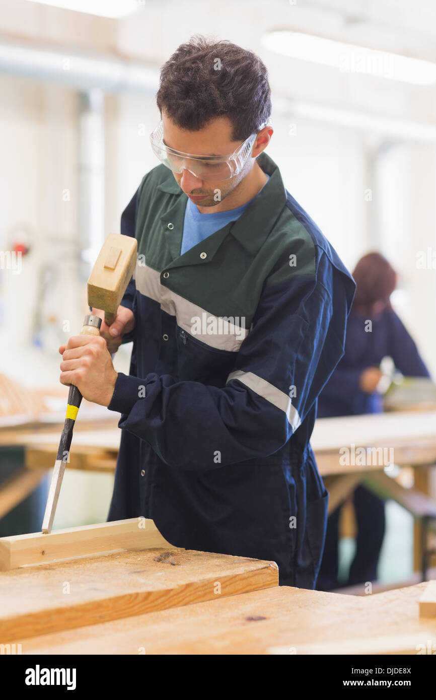 Carpenter using mallet and chisel Stock Photo Alamy