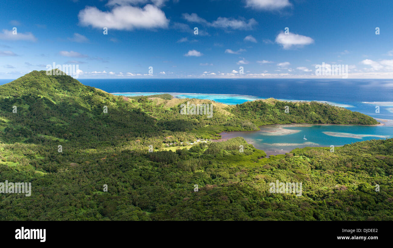 Topshot Matuku with a cruising yacht at anchor off village of Lomati (left of frame) Lau Islands, Fiji Stock Photo