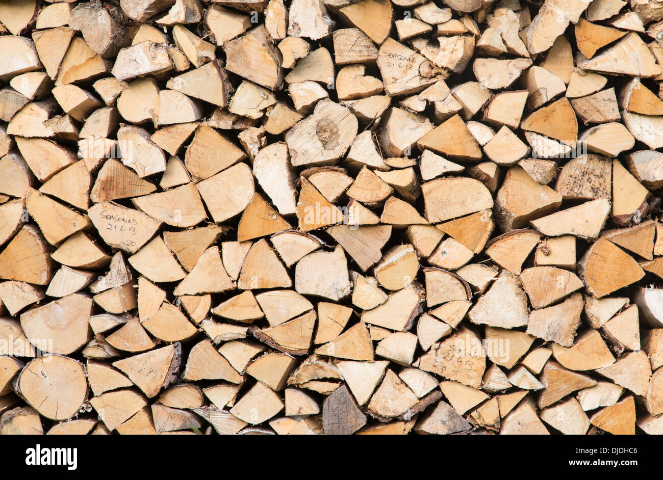 Store of logs for wood burning stove, England, UK Stock Photo Alamy