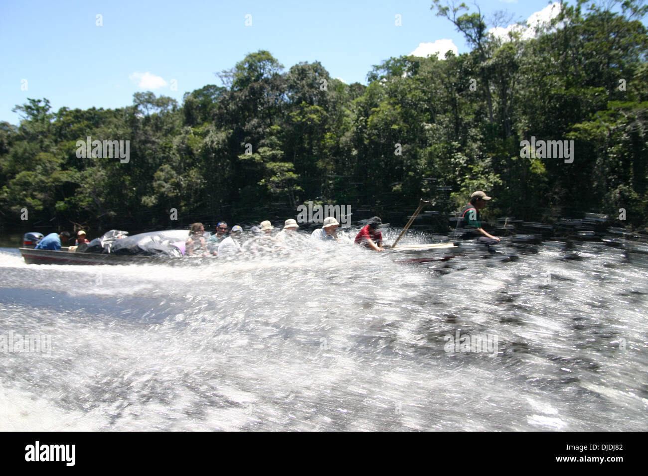 Speed boat travelling along the Churun river in Venezuela. The Churun River - Spanish: Río Churún) is part of the Orinoco River Stock Photo