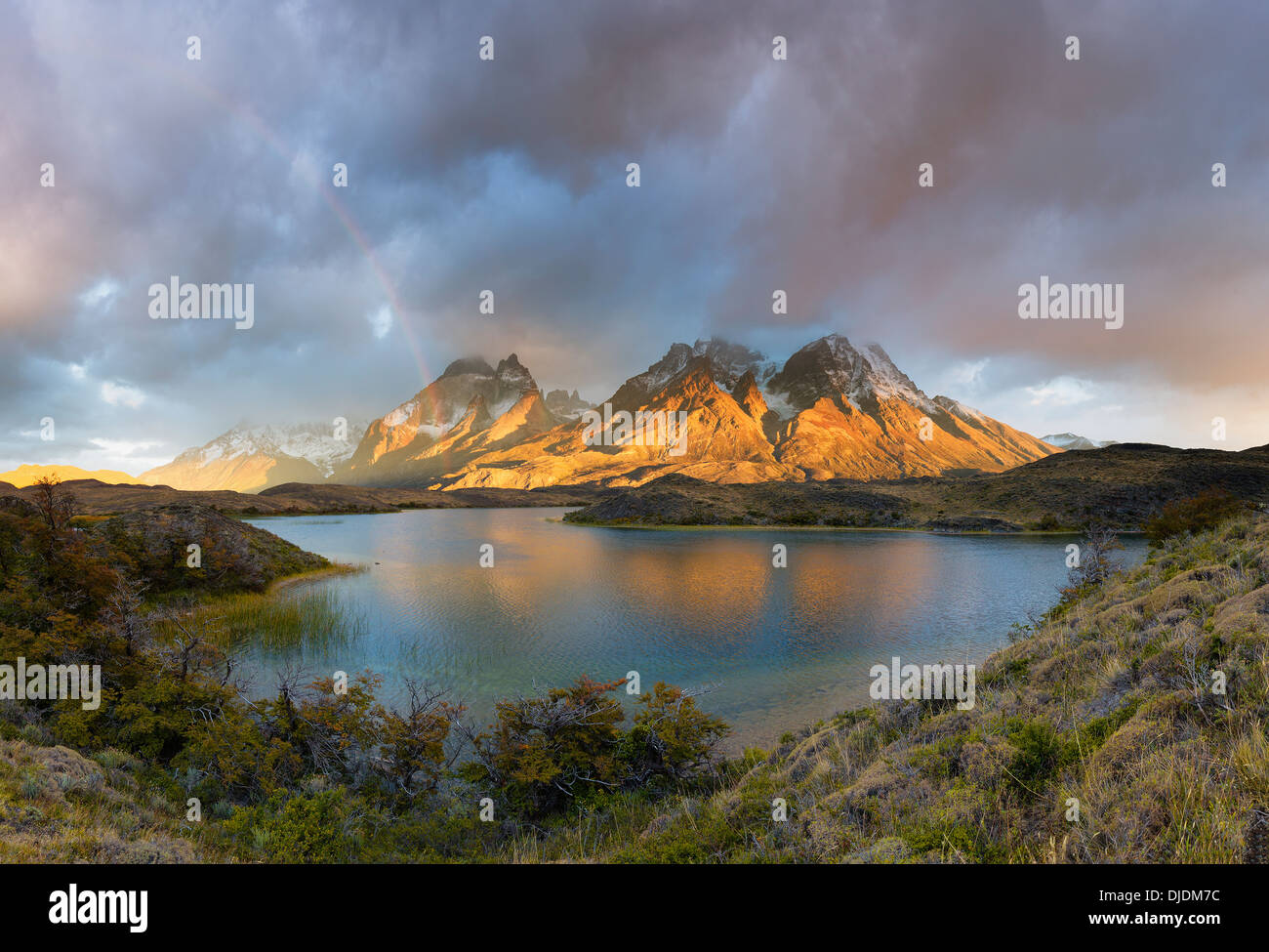 Sunlight and rainbow catching the peaks of Torres del Paine.Torres del Paine National Park.Patagonia.Chile Stock Photo