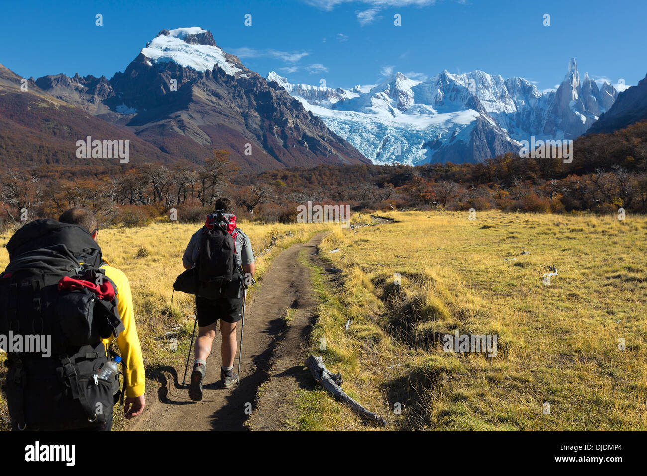 Tourists hiking on a path towards Los Cuernos 'the Horns' at Torres del Paine National Park, Chile Stock Photo