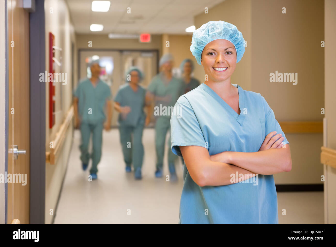 Surgeon Standing Arms Crossed In Hospital Corridor Stock Photo - Alamy