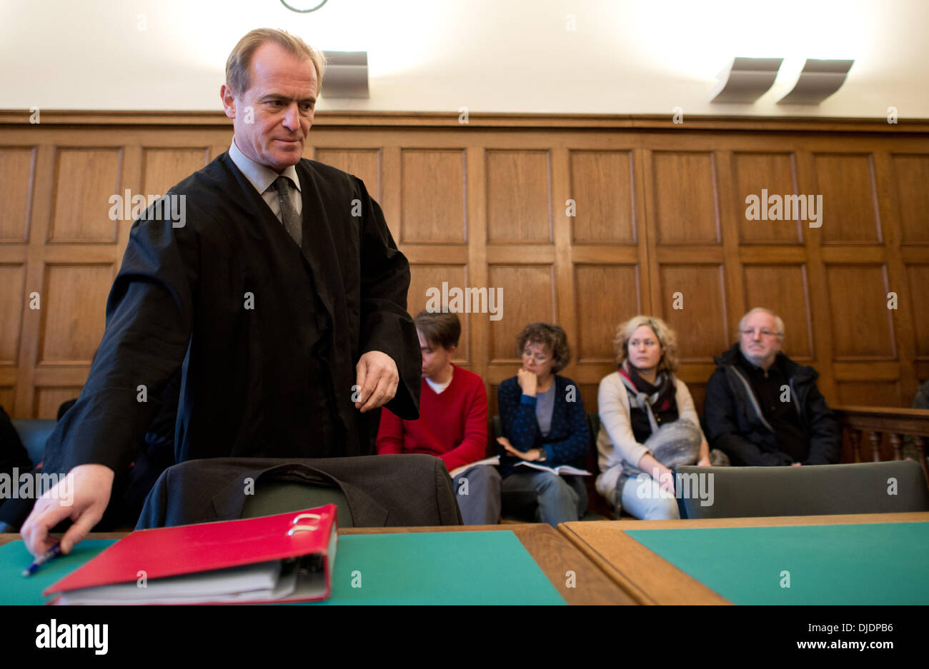 Berlin, Germany. 27th Nov, 2013. Lawyer for the "Widerstandsbewegung in Suedbrandenburg" (lit: resistance movement south Brandenburg) Wolfram Nahrath arrives in the in courtroom at the Higher Administrative Court Berlin-Brandenburg with in Berlin, Germany, 27 November 2013. The court is reviewing the legality of a ban on the neo-Nazi network by Brandenburg's interior minister in June 2012. Photo: BERND VON JUTRCZENKA/dpa/Alamy Live News Stock Photo