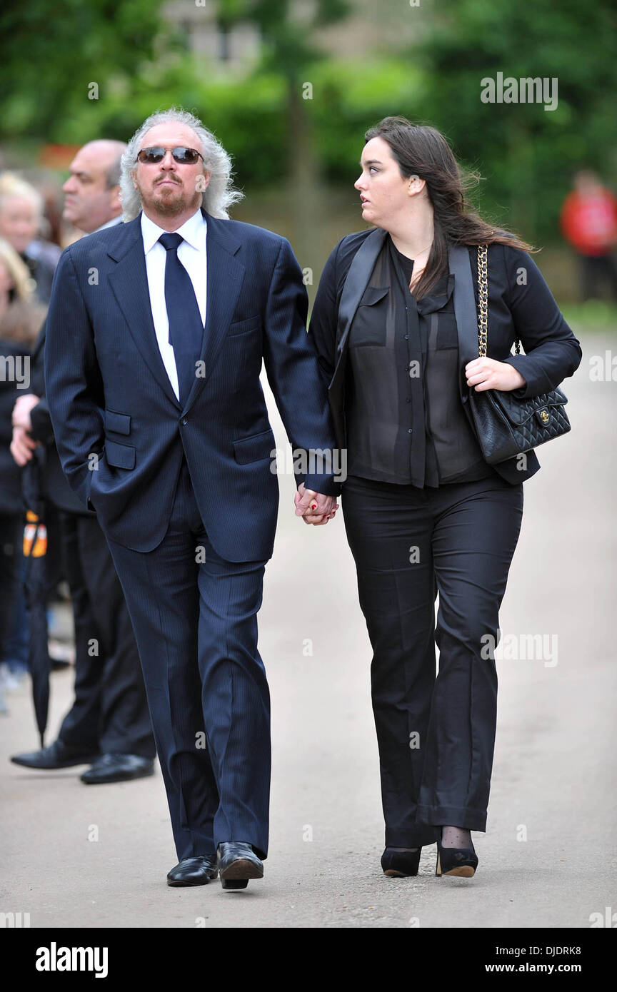 Barry Gibb and his daughter The funeral of Robin Gibb held in his home town of Thame Oxfordshire, England - 08.06.12 Stock Photo