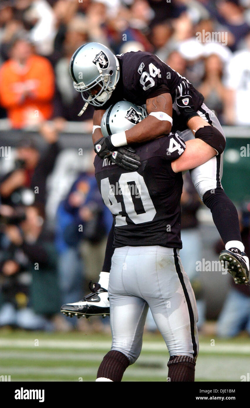 RAIDERS38-C-12JAN03-SP-PC Raiders #40 Jon Ritchie celebrates with #84 Jerry  Porter after Porter's third quarter touchdown. The Oakland Raiders play the  New York Jets in an AFC playoff game at the Oakland Coliseum