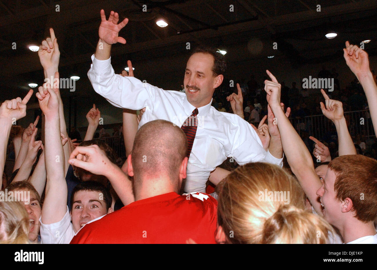 Mar 15, 2003 - Union, Kentucky, USA - St. Henry's Head Coach DAVE FAUST is carried off the court by fans, following his team's win over Simon Kenton High School  49 to 53 for the Kentucky 9th Region Boys Basketball Championship.  (Credit Image: © Ken Stewart/ZUMA Press) Stock Photo