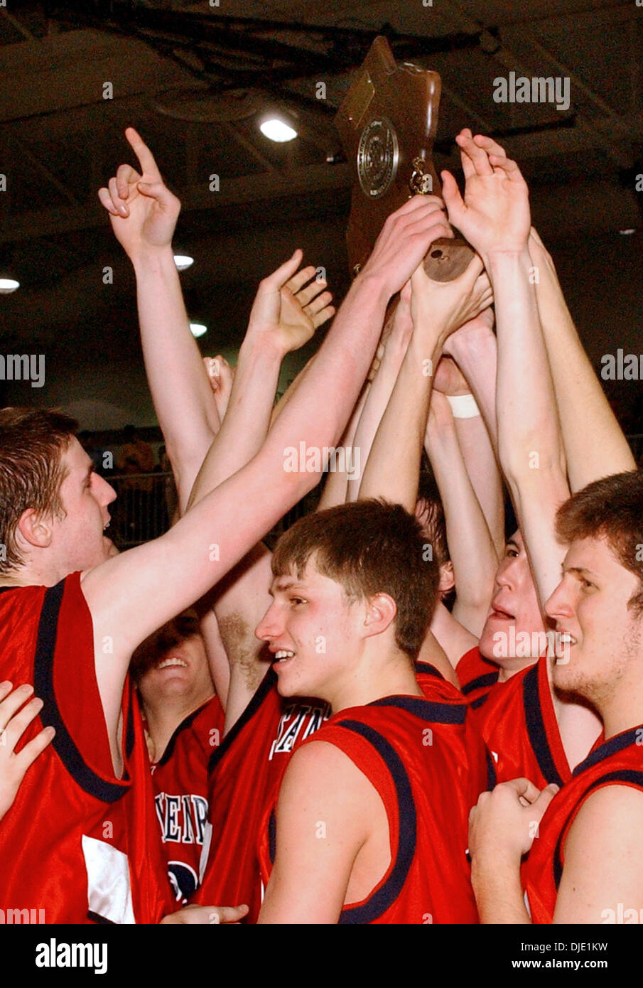 Mar 15, 2003 - Union, Kentucky, USA - St. Henry High School team members hold their trophy for their win over Simon Kenton High School. The final score was 49 to 53 for the Kentucky 9th Region Boys Basketball Championship.  (Credit Image: © Ken Stewart/ZUMA Press) Stock Photo