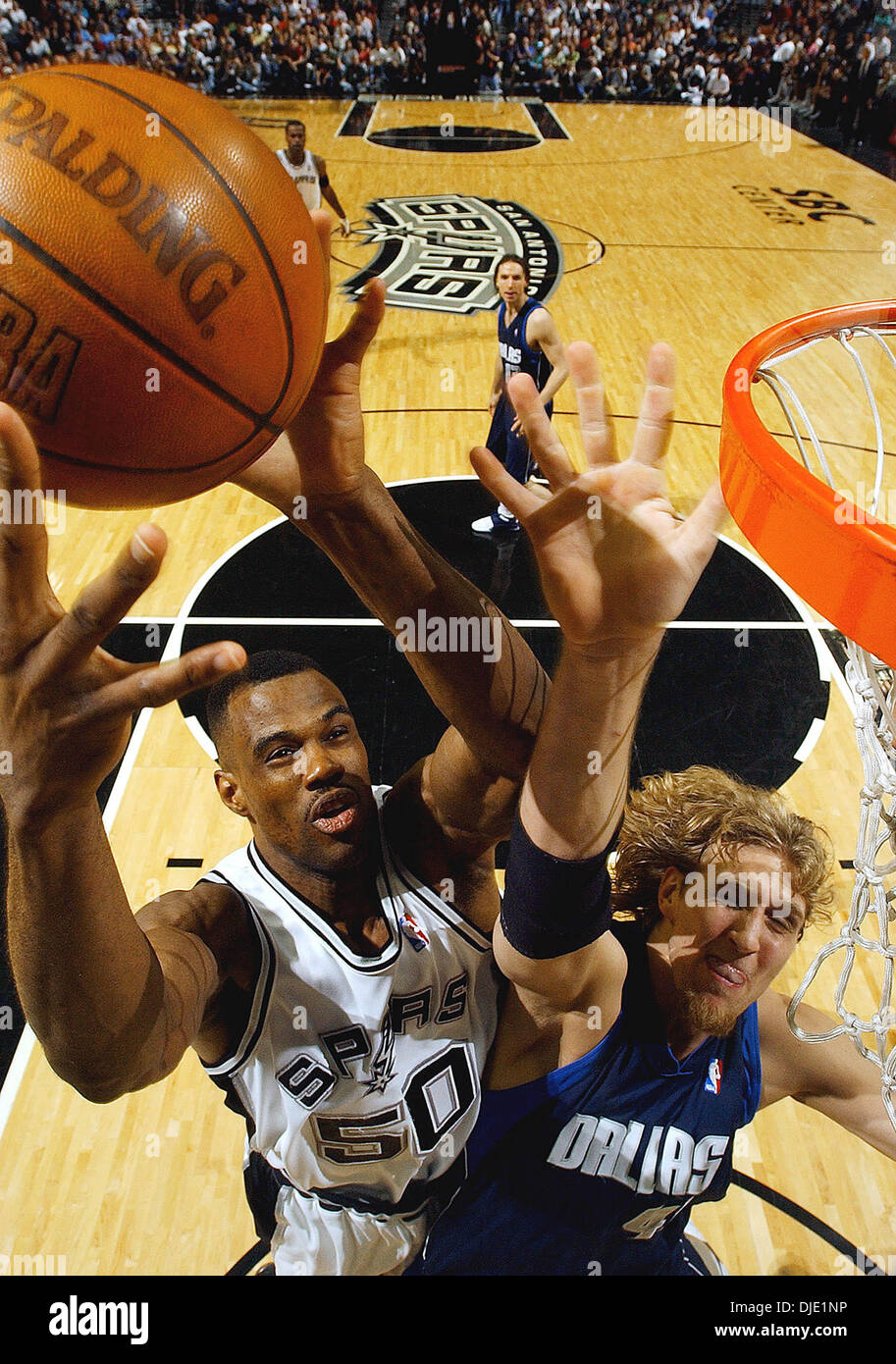 May 21, 2003; San Antonio, TX, USA; Spurs David Robinson goes for an offensive rebound against the Mavericks DIRK NOWITZKI during second half action in game two of the Western Conference Finals at the SBC Center Wednesday  May 21, 2003. Stock Photo