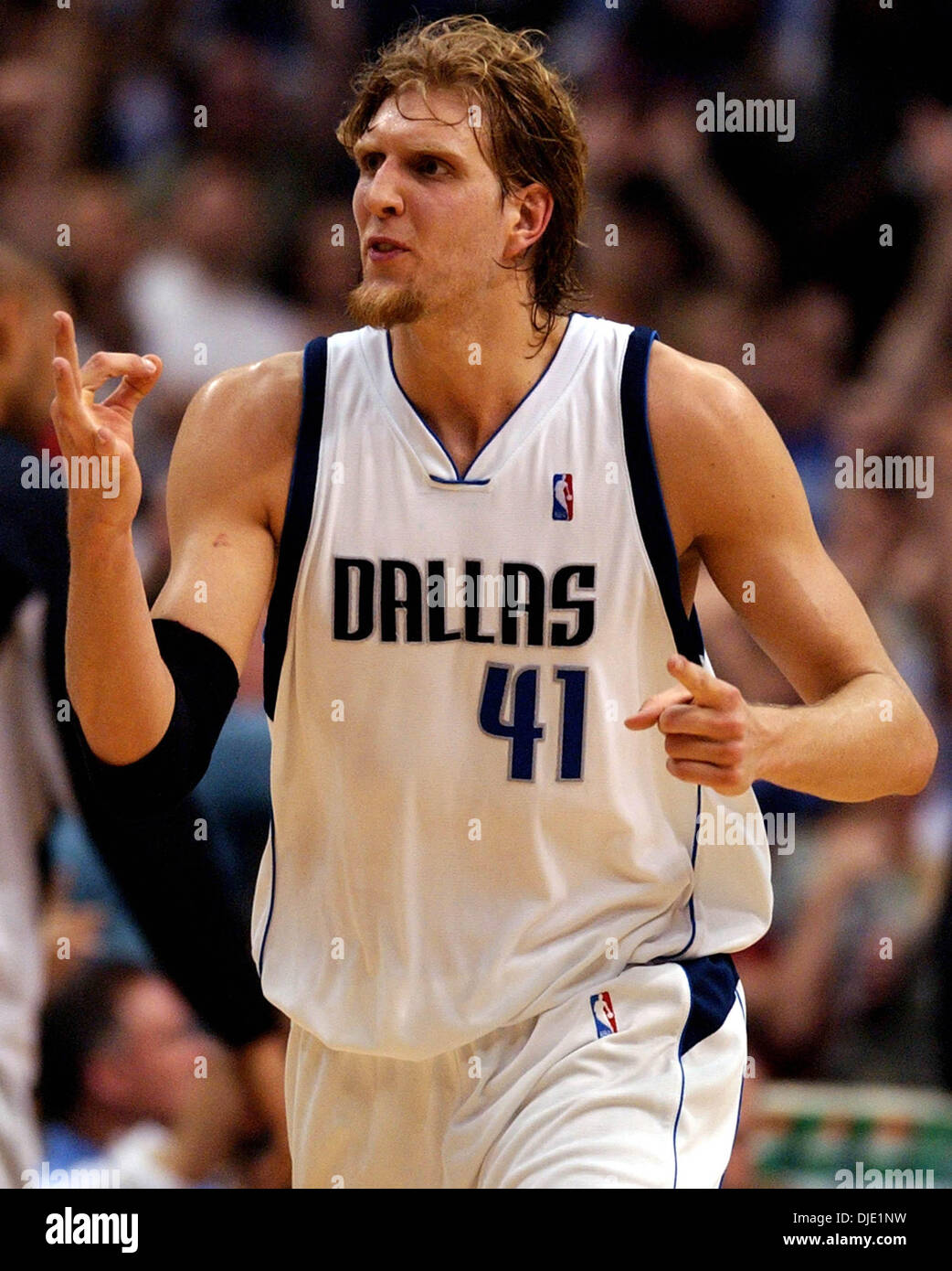 May 23, 2003; San Antonio, TX, USA; Mavs DIRK NOWITZKI signals three after hitting a three point shot during second quarter action in game three of the Western Conference Finals at the American Airlines Arena in Dallas May 23, 2003. Stock Photo