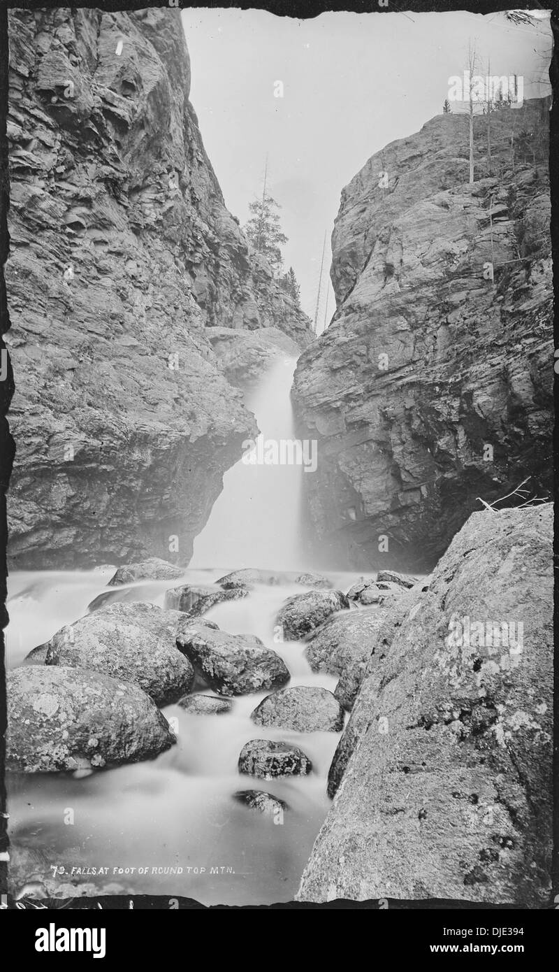 The photograph captures the dramatic falls at the base of Round ...